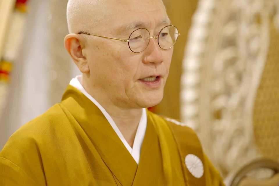 A visiting master from Japan speaks during the ceremony