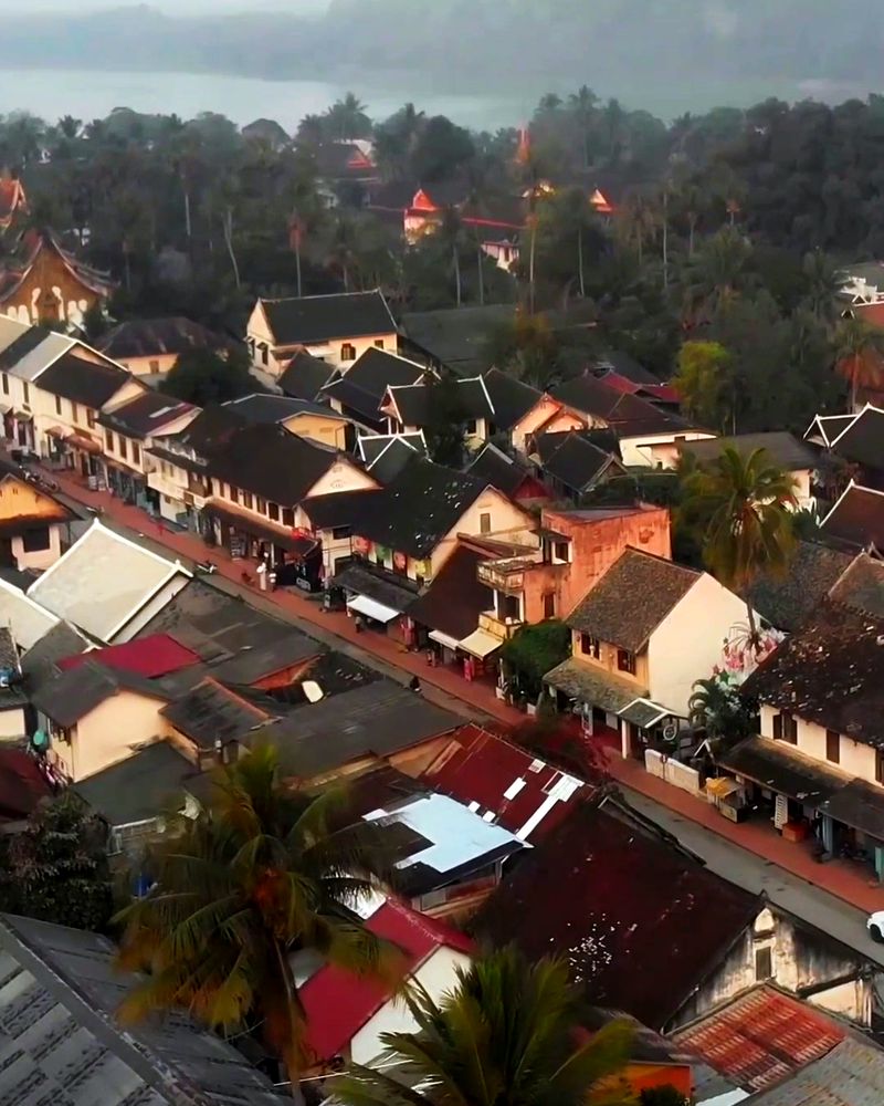 Aerial view over the rooftops of Luang Prabang to the river