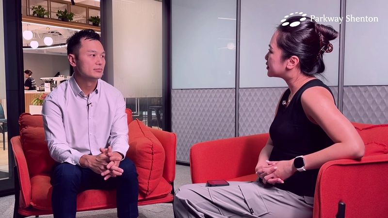 A family physician is interviewed in red armchairs at a Parkway Shenton clinic