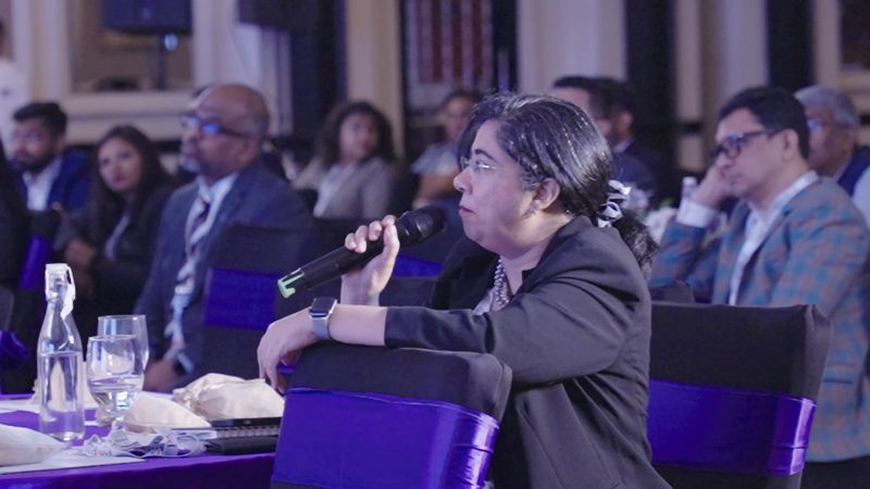 A delegate asks the panel a question from the floor