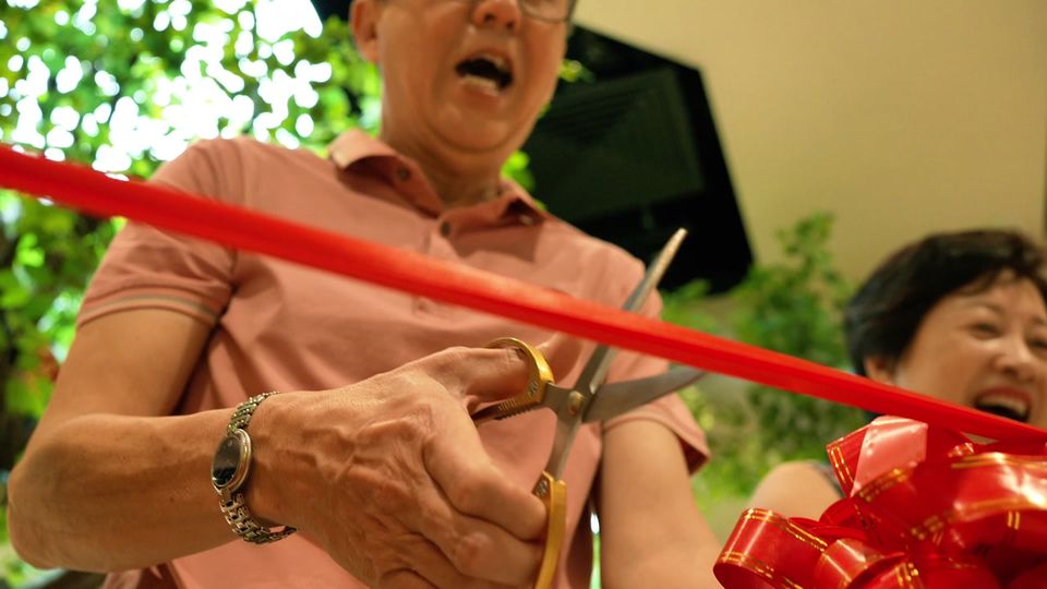 The ribbon is cut at the opening of the Foot Tree store